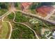 Aerial view of walking paths and mini golf. Future homesites and roads are actively being developed at 506 Healy Dr # 74, Cumming, GA 30040
