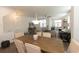 Dining room with a large table, neutral tones, and seamlessly connecting to the living space at 506 Healy Dr # 74, Cumming, GA 30040