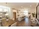 Bright, open-concept kitchen with stainless steel appliances, white cabinets, a large island, and adjacent dining area at 506 Healy Dr # 74, Cumming, GA 30040