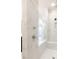 Luxurious shower with marble tile, rainfall showerhead, and built-in bench for a spa-like experience at 506 Healy Dr # 74, Cumming, GA 30040