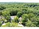 Panoramic aerial view of the property, highlighting its mature trees and proximity to the city skyline at 55 Bransford Rd, Sandy Springs, GA 30324