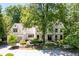 An aerial view of the neighborhood with mature trees, lush greenery and landscaping at 55 Bransford Rd, Sandy Springs, GA 30324