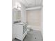 Bathroom with vanity and shower featuring stone floors, and updated fixtures at 55 Bransford Rd, Sandy Springs, GA 30324