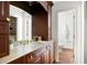 Bathroom with cherry cabinetry, marble countertops, gold fixtures, and a separate water closet at 55 Bransford Rd, Sandy Springs, GA 30324
