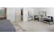 Bedroom with neutral walls, contemporary furnishings, and door to en-suite bath at 55 Bransford Rd, Sandy Springs, GA 30324
