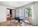 Bright dining room features hardwood floors, neutral decor, and abundant natural light from the sun-filled windows at 55 Bransford Rd, Sandy Springs, GA 30324