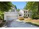 Charming home with well-manicured landscaping, a two-car garage, and brick accents at 55 Bransford Rd, Sandy Springs, GA 30324