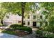 Beautiful two-story home with mature trees and a well-manicured front yard at 55 Bransford Rd, Sandy Springs, GA 30324