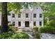 Charming two-story home featuring a well-manicured front yard and a brick exterior at 55 Bransford Rd, Sandy Springs, GA 30324