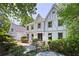 Charming two-story home featuring a well-manicured front yard and a brick exterior at 55 Bransford Rd, Sandy Springs, GA 30324