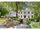 Charming two-story home featuring a well-manicured front yard and a brick exterior at 55 Bransford Rd, Sandy Springs, GA 30324