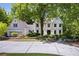 Charming two-story home featuring a well-manicured front yard and a brick exterior at 55 Bransford Rd, Sandy Springs, GA 30324