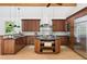 Well-equipped kitchen featuring stainless steel appliances, granite countertops, and a functional island at 55 Bransford Rd, Sandy Springs, GA 30324