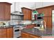 Gourmet kitchen with stainless steel appliances, center island and custom cabinetry at 55 Bransford Rd, Sandy Springs, GA 30324