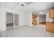 Kitchen featuring white tile flooring, light wood cabinets, and white appliances at 55 Bransford Rd, Sandy Springs, GA 30324