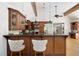 Open-concept kitchen featuring modern appliances, breakfast bar, and seamless flow to living area at 55 Bransford Rd, Sandy Springs, GA 30324