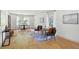 Bright living area boasts hardwood floors, neutral walls and a cozy sitting area near a large window at 55 Bransford Rd, Sandy Springs, GA 30324