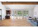 Bright living room with hardwood floors, built-in desk, and doors to deck at 55 Bransford Rd, Sandy Springs, GA 30324