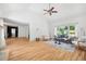 Spacious living room features gleaming hardwood floors, a vaulted ceiling, neutral paint, and sun-filled windows at 55 Bransford Rd, Sandy Springs, GA 30324