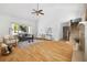 Inviting living room with vaulted ceiling, hardwood floors, neutral decor, and abundant natural light from large windows at 55 Bransford Rd, Sandy Springs, GA 30324