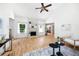 Cozy living room features hardwood floors, fireplace, neutral decor, and abundant natural light from sun-filled windows at 55 Bransford Rd, Sandy Springs, GA 30324