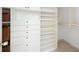 Organized walk-in closet with shelving, drawers, and ample storage space at 55 Bransford Rd, Sandy Springs, GA 30324