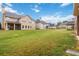Large backyard offers plenty of space for outdoor activities and relaxation at 651 Deer Springs Way, Loganville, GA 30052