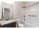 Bathroom featuring granite counters, a mirror, and a shower-tub combo at 651 Deer Springs Way, Loganville, GA 30052