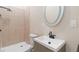 Cozy bathroom featuring neutral tile, a sink with modern fixtures, and a standing shower at 651 Deer Springs Way, Loganville, GA 30052