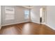 Spacious bedroom with hardwood floors and windows that provide natural light at 651 Deer Springs Way, Loganville, GA 30052