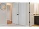 Bedroom with walk-in closets and doorway to bathroom and hallway at 651 Deer Springs Way, Loganville, GA 30052