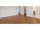 Clean bedroom featuring hardwood floors with doors leading to bathroom and closet at 651 Deer Springs Way, Loganville, GA 30052