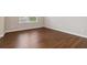 Clean bedroom with hardwood floors and a window that provides natural light at 651 Deer Springs Way, Loganville, GA 30052