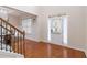 Elegant foyer featuring hardwood floors, a staircase with black iron railings, and natural light at 651 Deer Springs Way, Loganville, GA 30052