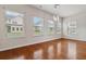 Open living space with hardwood floors, recessed lighting, and multiple windows offering plenty of natural light at 651 Deer Springs Way, Loganville, GA 30052