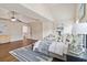 Bright main bedroom with hardwood floors, and a king size bed with modern decor and ceiling fan at 651 Deer Springs Way, Loganville, GA 30052