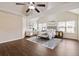 Expansive main bedroom with hardwood floors, seating, large windows, and modern decor at 651 Deer Springs Way, Loganville, GA 30052