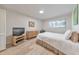 Bright bedroom features natural light, hardwood floors, and neutral paint, creating a relaxing and inviting space at 1111 Clairemont Ave # N3, Decatur, GA 30030