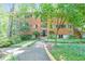 Traditional brick building with manicured landscaping and a welcoming entrance at 1111 Clairemont Ave # N3, Decatur, GA 30030
