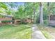 Exterior view of building with brick facade, with lush greenery, landscaping, and trees at 1111 Clairemont Ave # N3, Decatur, GA 30030