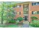 Traditional brick building with a garden and black window shutters at 1111 Clairemont Ave # N3, Decatur, GA 30030