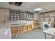 Utility room featuring a washer, dryer, ironing board, and shelving, perfect for organization at 1111 Clairemont Ave # N3, Decatur, GA 30030