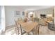 Living room and dining room featuring hardwood floors and ample lighting at 1111 Clairemont Ave # N3, Decatur, GA 30030