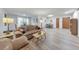 Bright living room featuring hardwood floors and large windows, offering ample natural light at 1111 Clairemont Ave # N3, Decatur, GA 30030