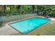 Exterior shot of community pool with lounge chairs and lush green surroundings, creating a relaxing oasis at 1111 Clairemont Ave # N3, Decatur, GA 30030