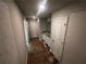 Hallway with a bathroom featuring a double sink vanity and a white tiled shower stall at 192 Paces Lakes Pt, Dallas, GA 30157