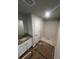 Bathroom with a granite countertop vanity and a separate shower room with tile surround at 192 Paces Lakes Pt, Dallas, GA 30157