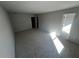 An expansive carpeted bedroom with a view of a closet and natural light streaming through the window at 192 Paces Lakes Pt, Dallas, GA 30157