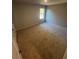 A bright, carpeted bedroom featuring a window that provides natural light into the room at 192 Paces Lakes Pt, Dallas, GA 30157