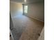 A cozy bedroom featuring plush carpeting, neutral walls, and a window for ample natural light at 192 Paces Lakes Pt, Dallas, GA 30157